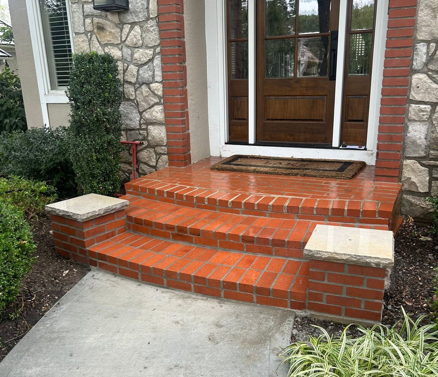 Brick entry steps rebuilt with stone caps
