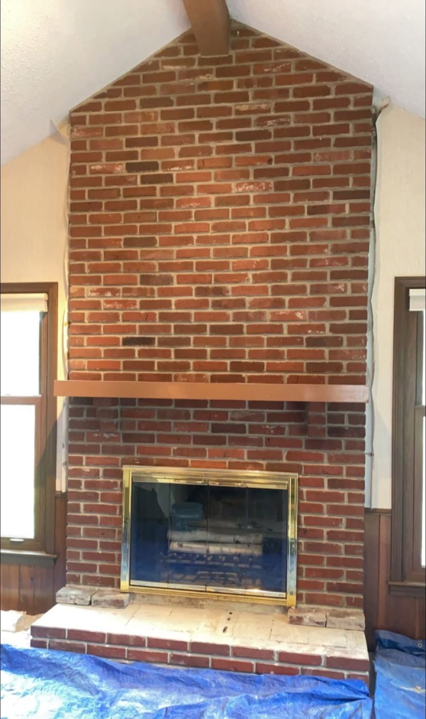 Original red brick fireplace before refacing