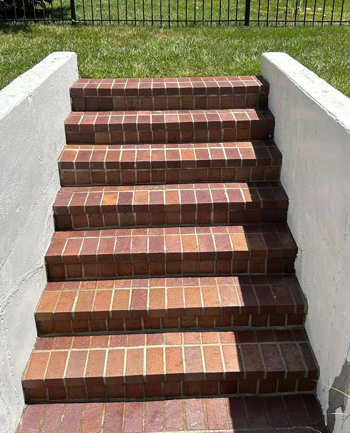 Brick stairs between concrete walls