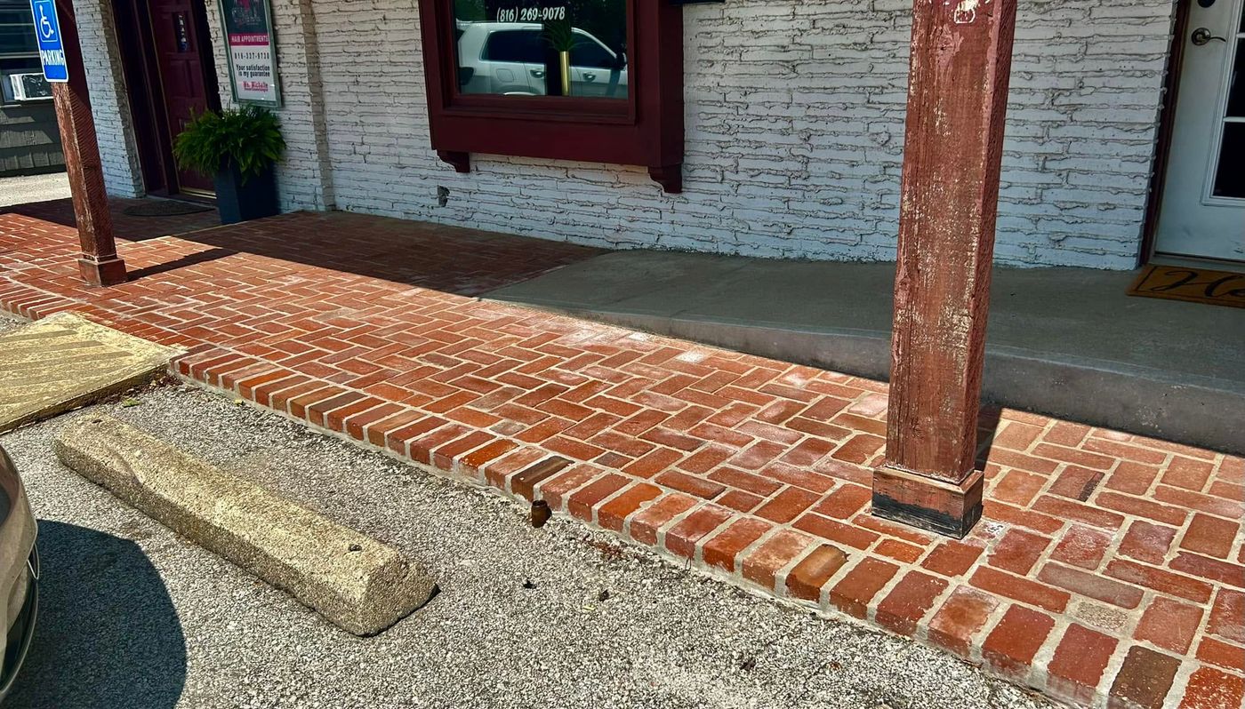 Brick sidewalk relaid straight with a clean edge