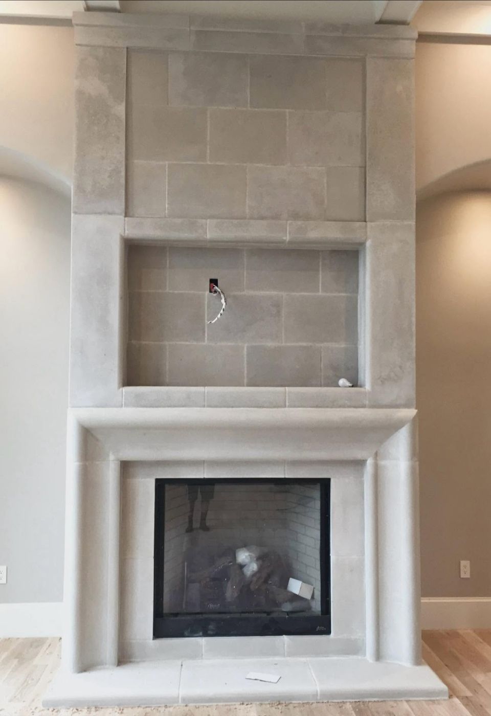 Cast stone fireplace and TV surround