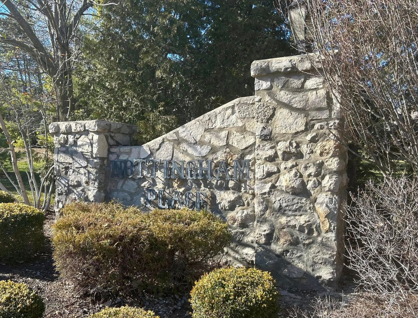 Stone neighborhood sign wall