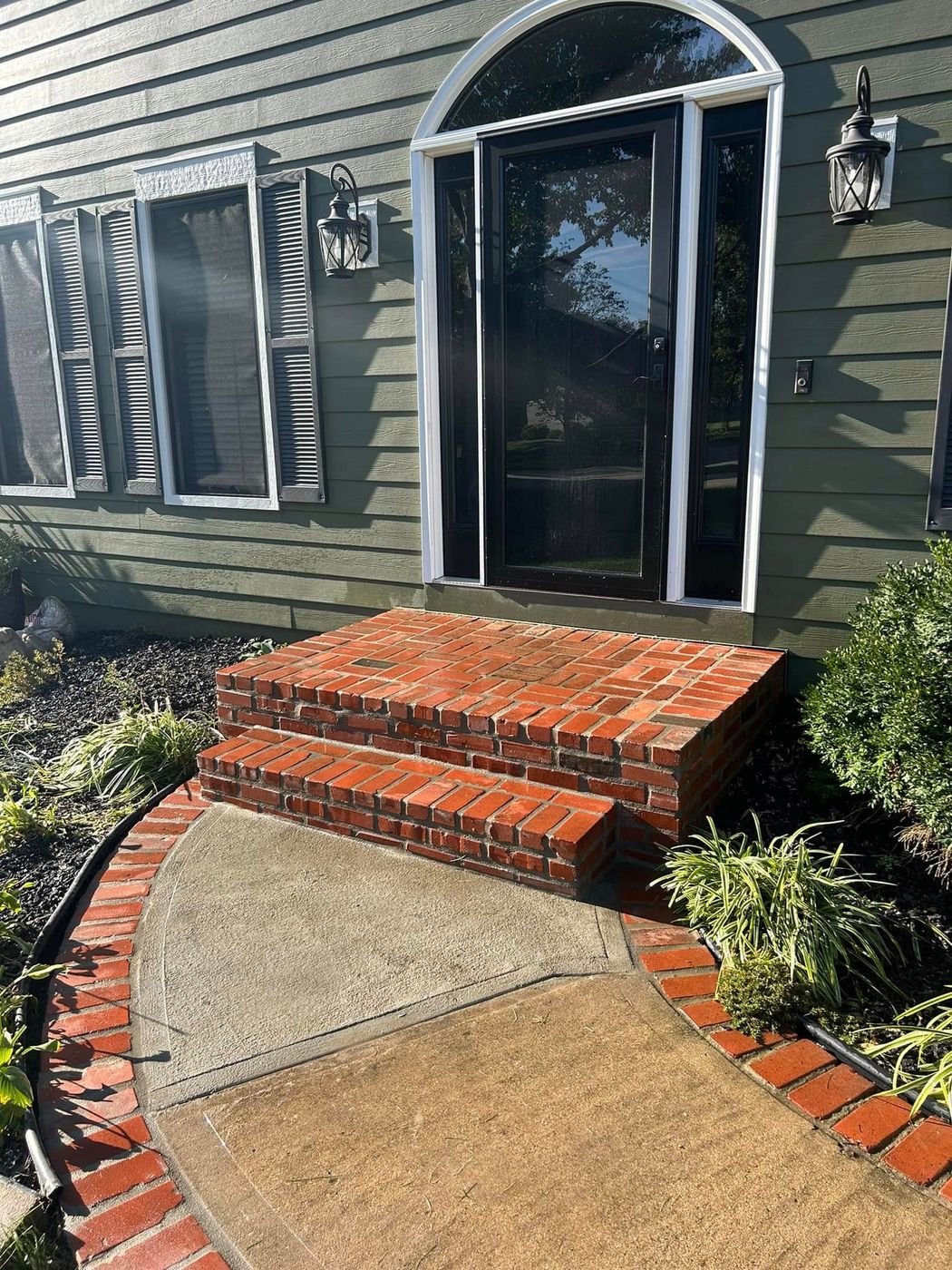 New brick entry steps and brick-edged walk