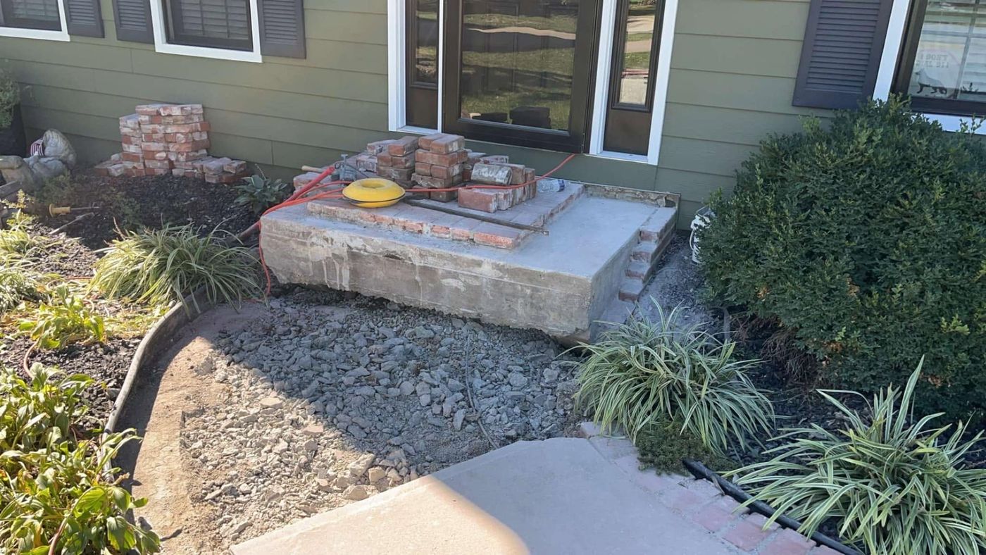 Broken front steps torn out