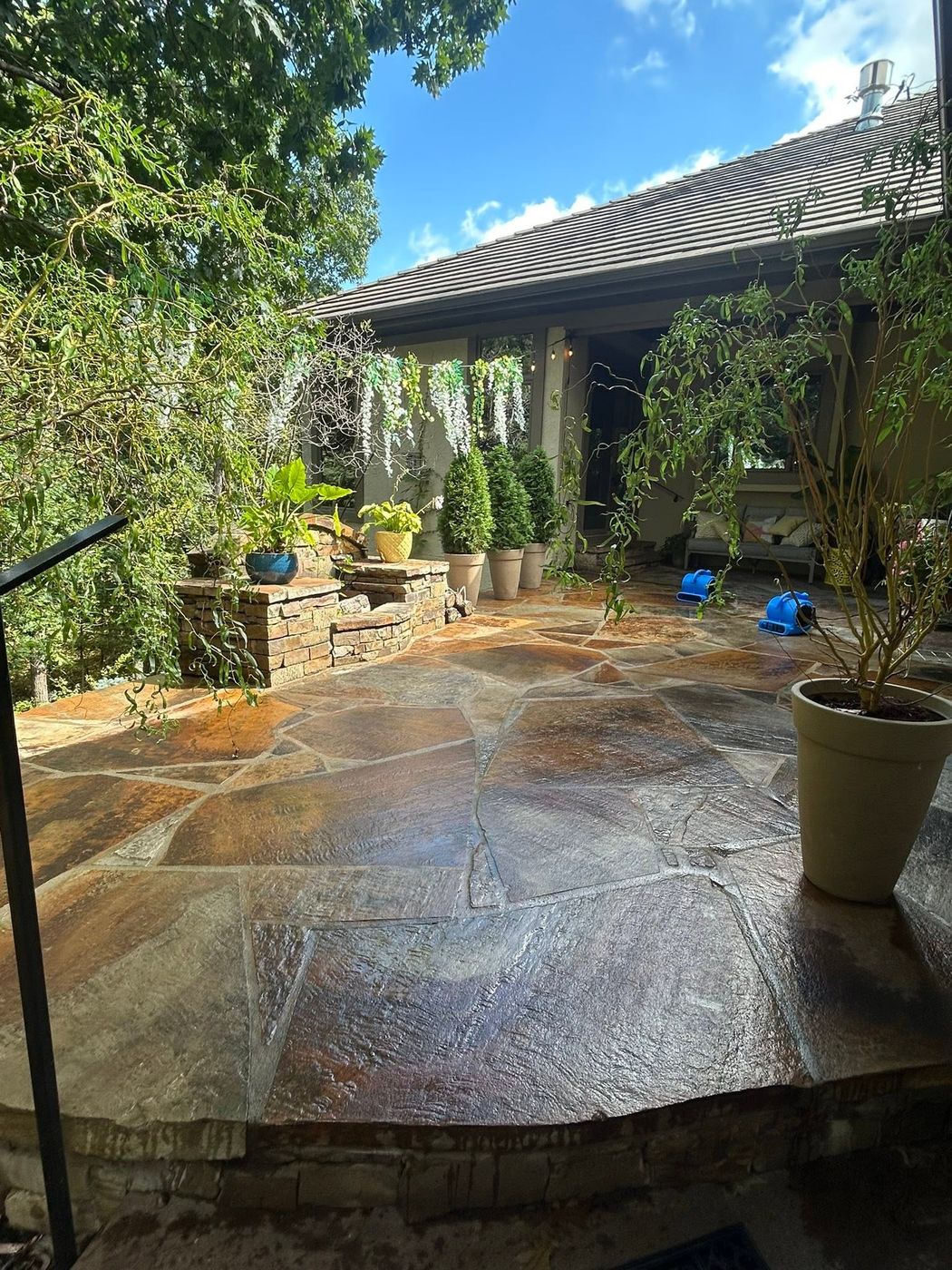Large flagstone patio in a backyard