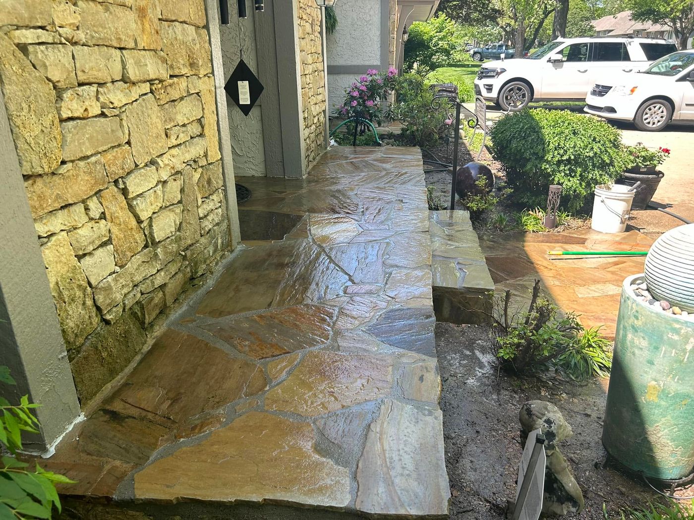 Flagstone walkway along a stone wall