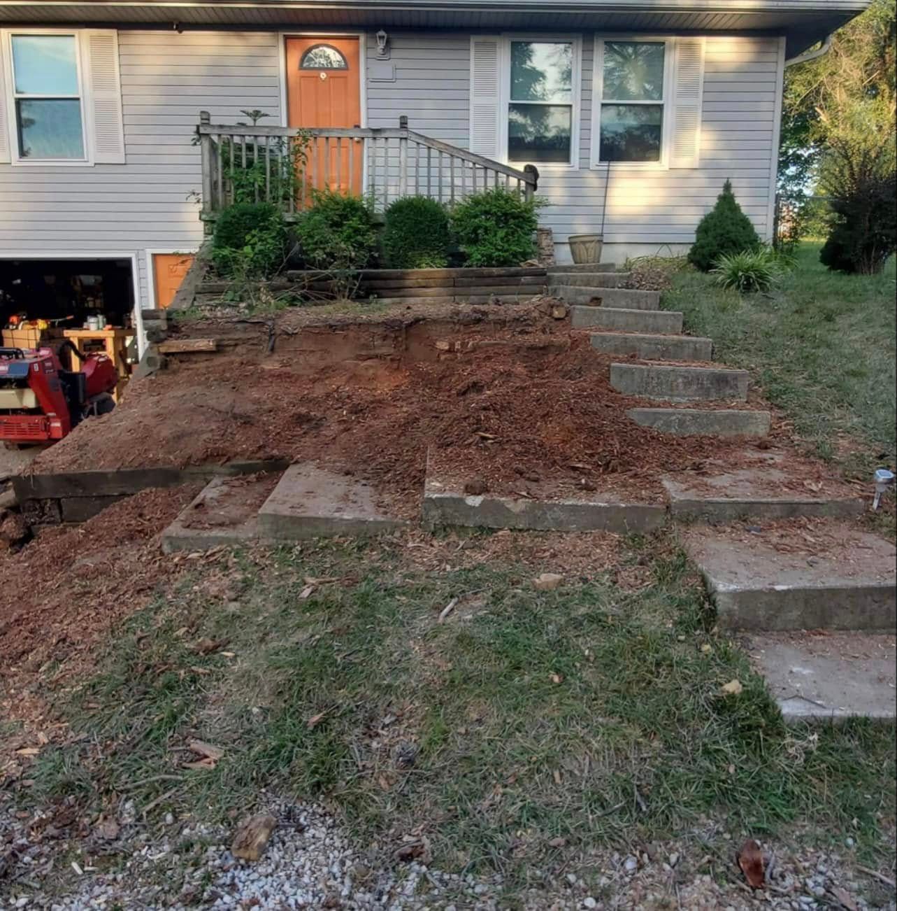 Bare dirt hillside with old steps