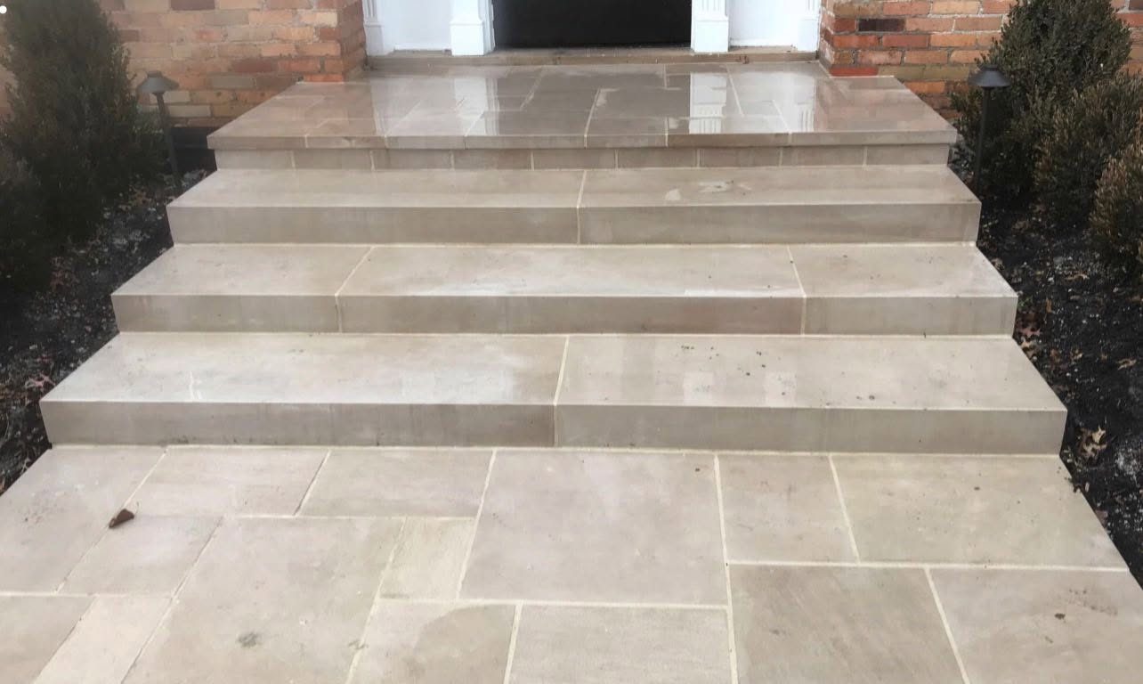 Smooth limestone entry steps and landing