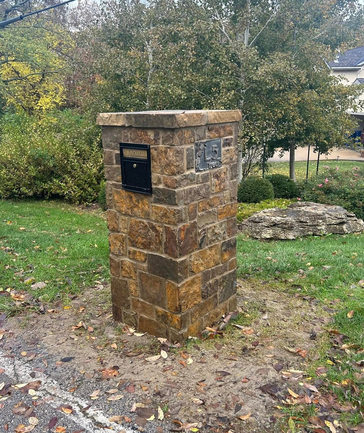 Fieldstone mailbox column with address plaque