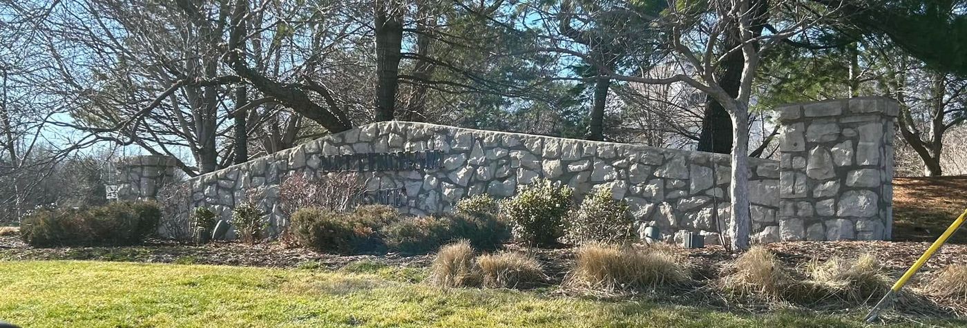 Long stone neighborhood entrance wall