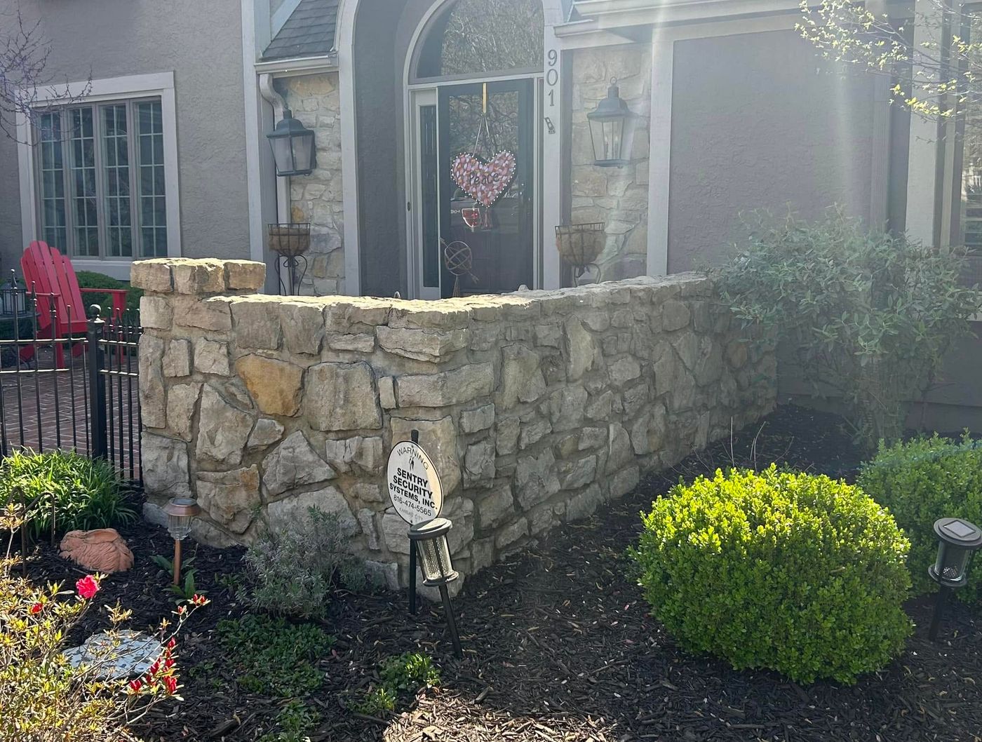Same stone wall clean after powerwashing