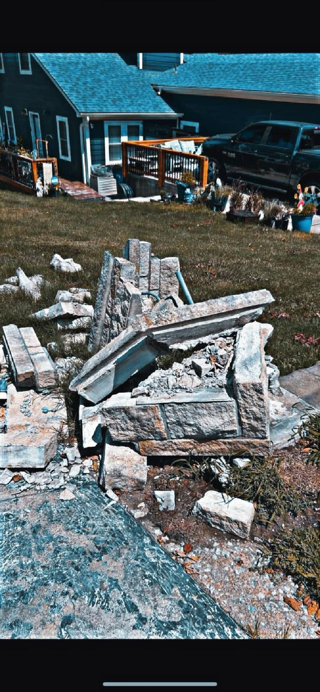 Stone pillar knocked down into rubble