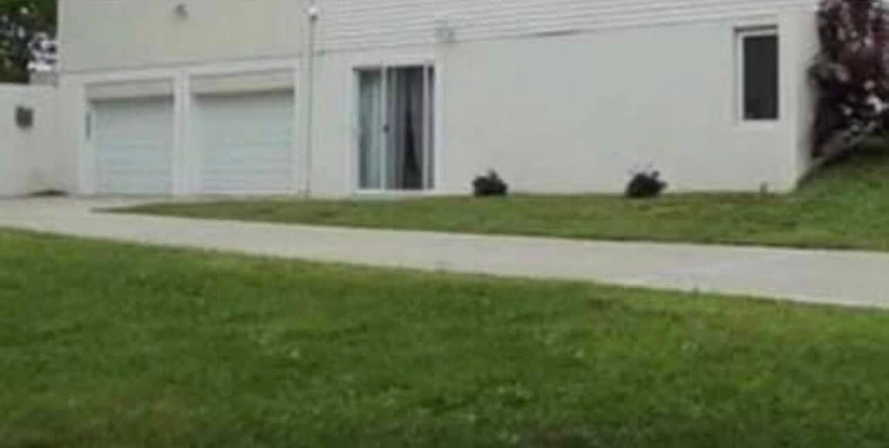 Plain painted foundation wall by the garage